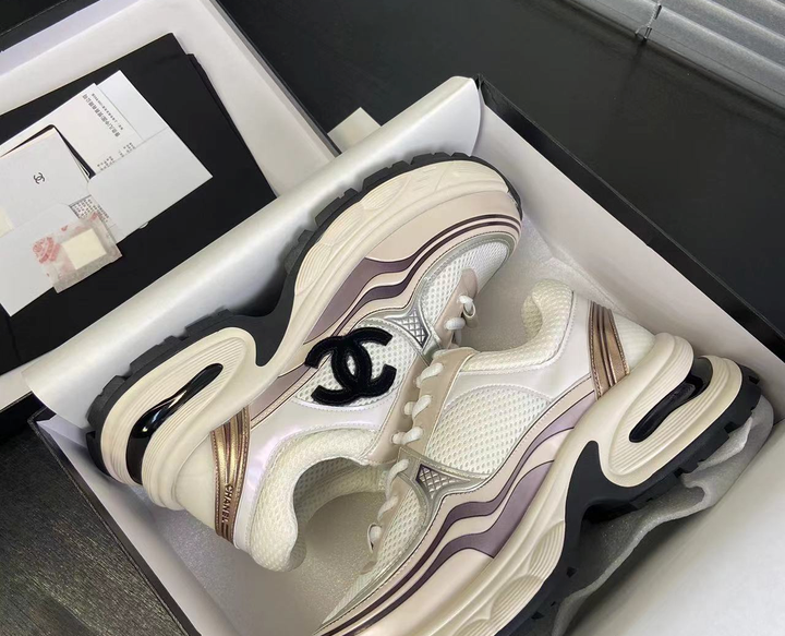 Cream and metallic designer sneakers